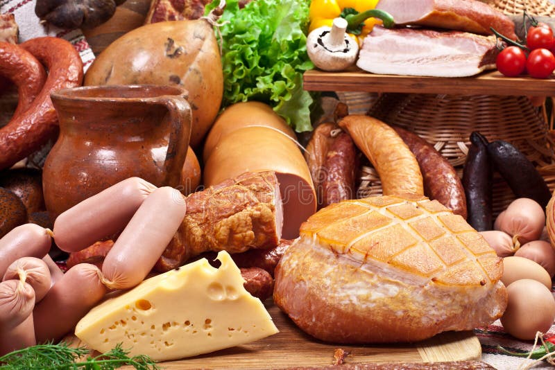 Variety of sausage products, cheese, eggs and vegetables.