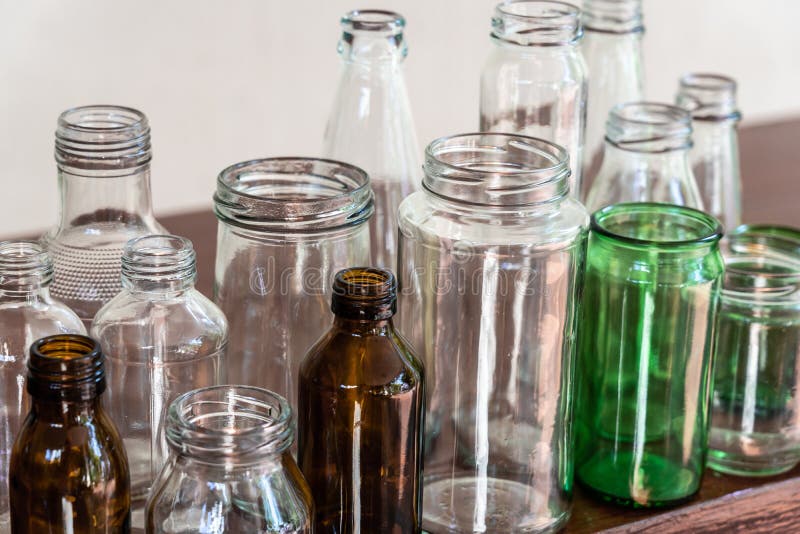 Variety shape and color of empty glass container bottles, reuse things concept