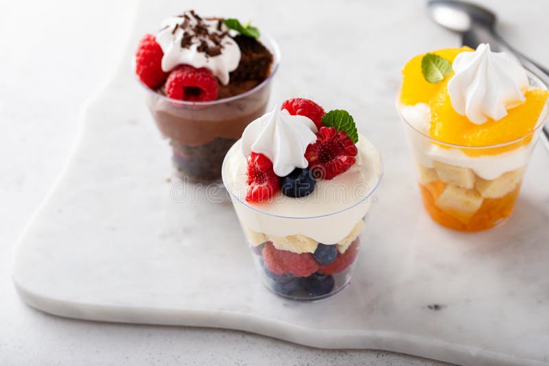 Variety of Small Desserts in Cups, Chocolate, Berry and Orange Stock