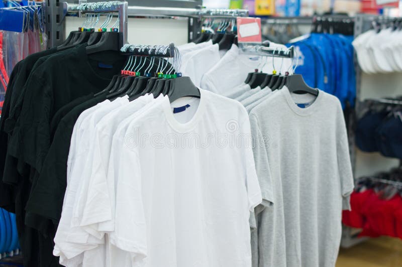 Variety of T-shirts on Stands in Supermarket Stock Image - Image of ...