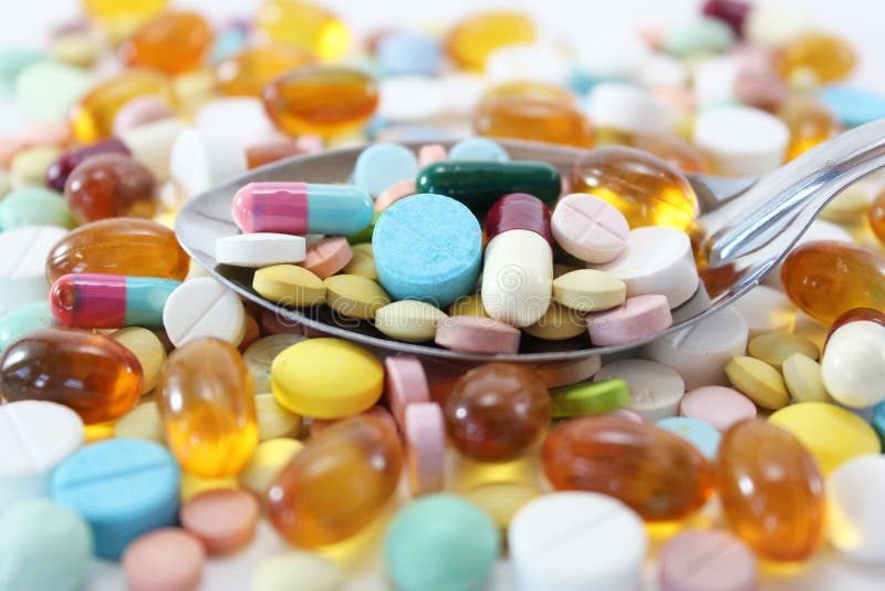 Various colorful medicine drugs on spoon. Various colorful medicine drugs, pills, capsules, tablets on spoon stock image Various colorful medicine drugs on spoon. Various colorful medicine drugs, pills, capsules, tablets on spoon stock image