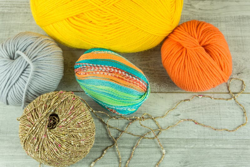 Various Colors Wool Balls in a Wooden Box with Knitting Needles Stock