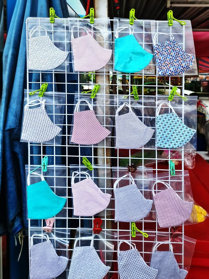 Various Designs of Cloth Face Masks for Sale at Market Stock Photo