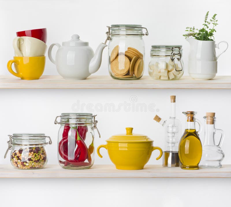 Various food ingredients and utensils on kitchen shelves isolated