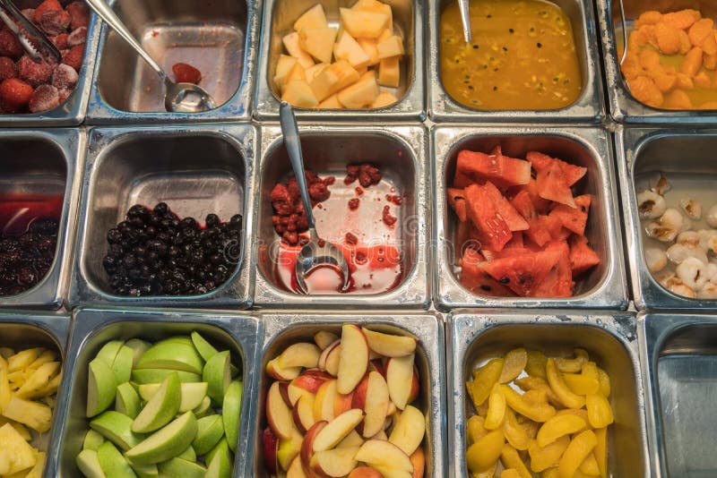 Various Fresh Fruit and Vegetable Salad Bar Healthy Items Stock Photo