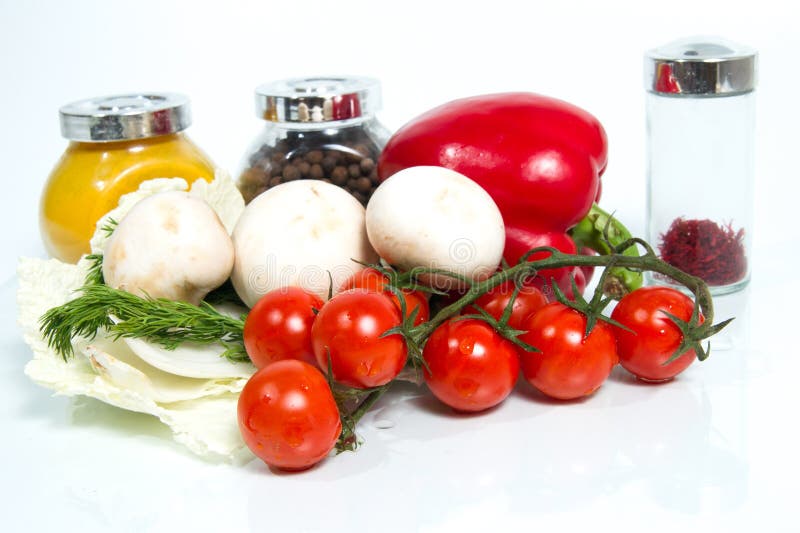 Various fresh vegetables, mushrooms and spices on white backgro