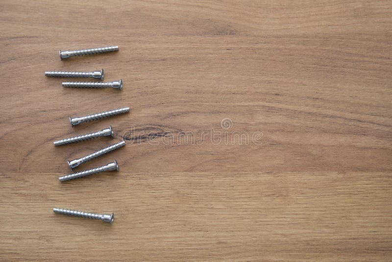 Various Furniture Fittings For Assembling On Wooden Background
