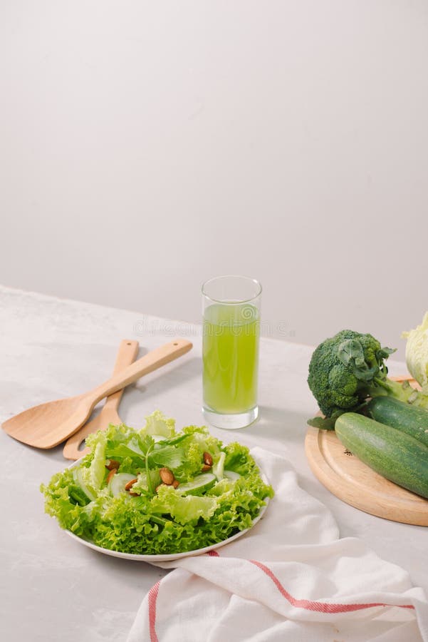 Various green organic salad ingredients on white background. Healthy lifestyle or detox diet food concept stock photography Various green organic salad ingredients on white background. Healthy lifestyle or detox diet food concept stock photography