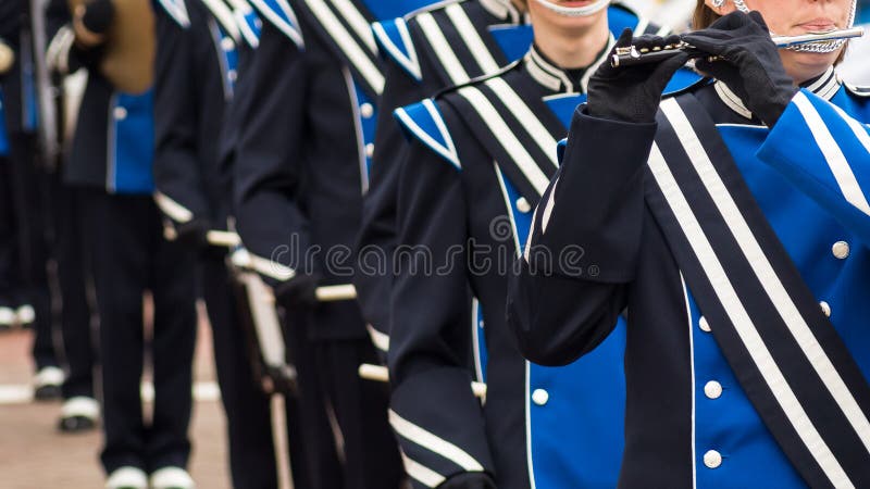 Close up and details of playing musicians, instruments in a marching, show band or music band. Close up and details of playing musicians, instruments in a marching, show band or music band