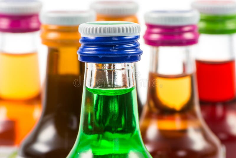 Various Isolated Liqueur Bottles with Party Drinks Stock Photo Image