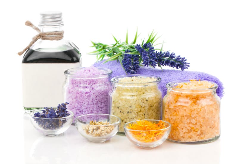 Various kinds of bath salt with flowers royalty free stock photography