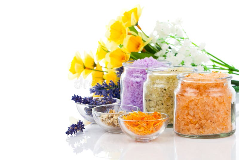 Various kinds of bath salt with flowers stock image