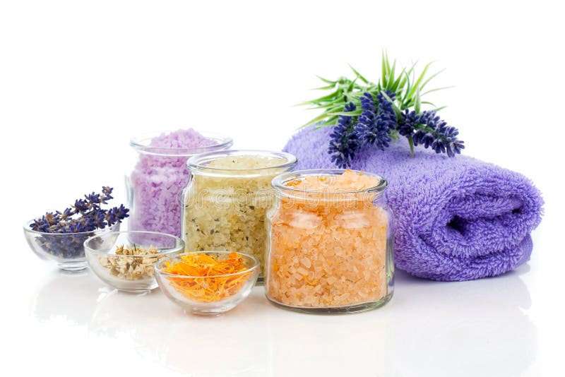Various kinds of bath salt with flowers royalty free stock image