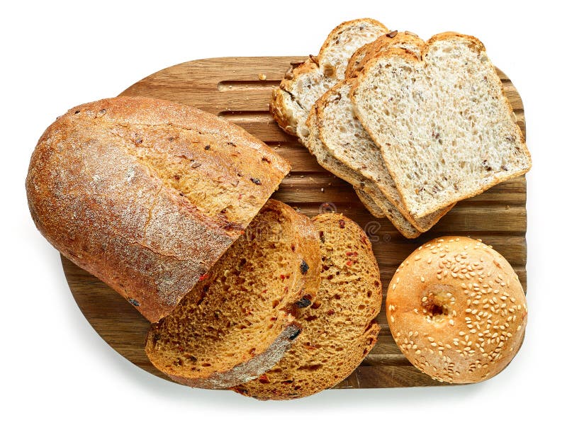 Various kinds of bread on cutting board royalty free stock image