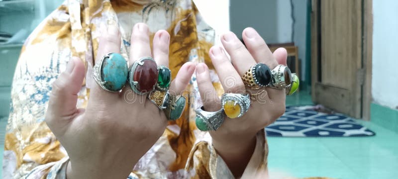 Various kinds of rings on the fingers stock photo