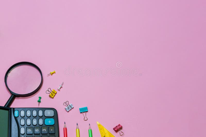 Various office supplies on a pink background. Back to school concept. stock image