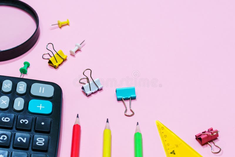 Various office supplies on a pink background. Back to school concept. royalty free stock photography