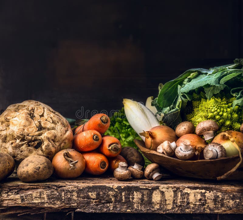 Various of raw vegetables and field mushroom on old dark wooden