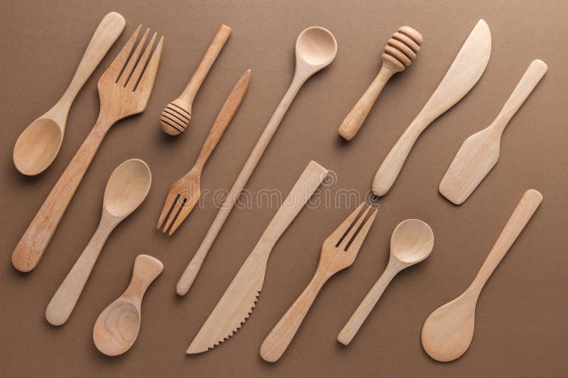 Various recycled Wooden Bakery kitchenware arranged on a beige background royalty free stock photography
