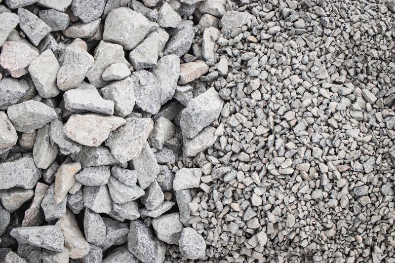 Various sizes of gray stone aggregate ready for construction at a building site royalty free stock photo