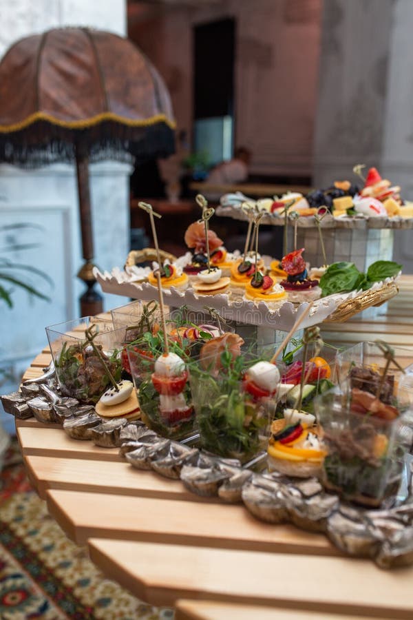Various Snacks and Drinks on the Table at the Event Stock Photo Image