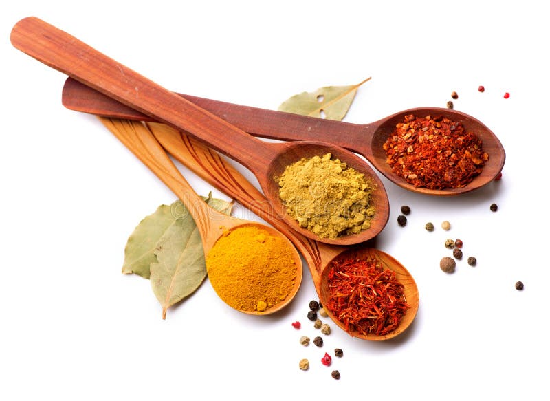 Various spices and herbs over white