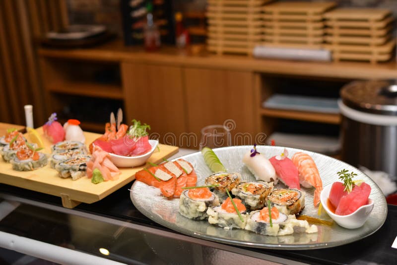 Various Sushi on Plates at Restaurant. Stock Photo Image of asian