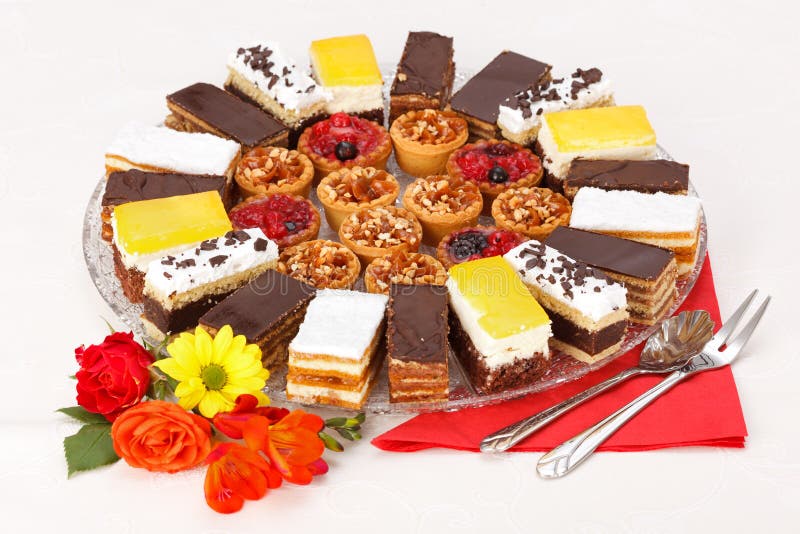 Various sweet cakes on round plate