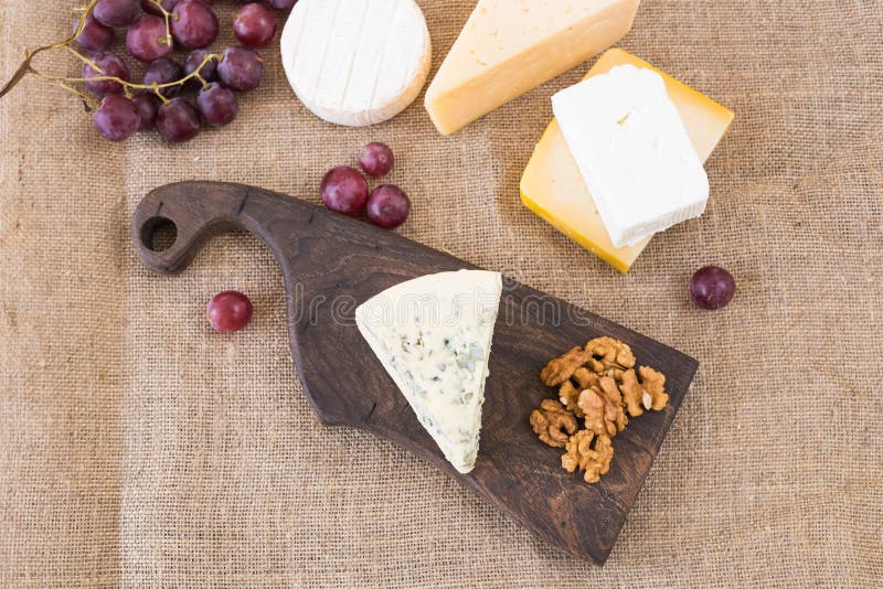 Various Types of Cheese, Blue Cheese and Brie with Grapes and Nuts Stock Image Image of