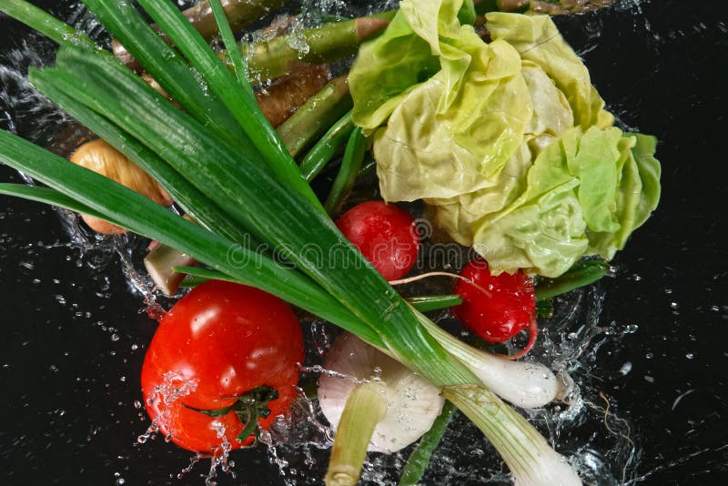 Various vegetables on black background stock photography