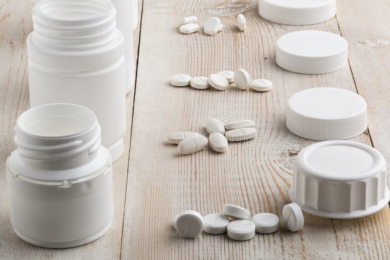 Plastic Pill Bottle and Heap of Round White Pills Stock Image Image
