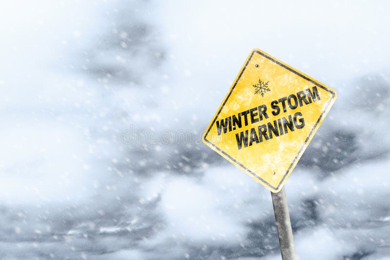 Winter storm season with snowflake symbol sign against a snowy background and copy space. Snow splattered and angled sign adds to the drama. Winter storm season with snowflake symbol sign against a snowy background and copy space. Snow splattered and angled sign adds to the drama