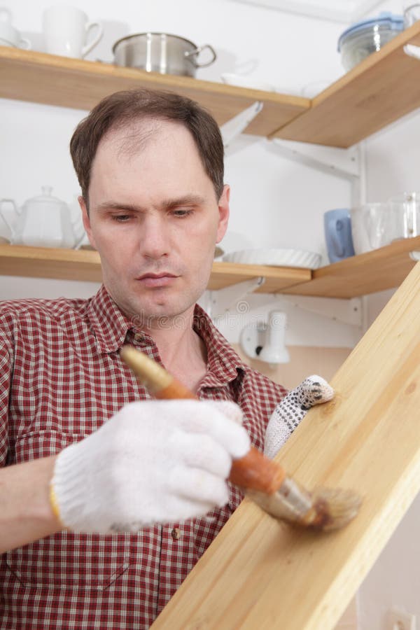 Varnishing wood shelves stock images Varnishing wood shelves stock images