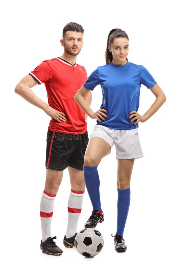 Varón y un jugador de fútbol de sexo femenino con un fútbol foto de archivo libre de regalías Varón y un jugador de fútbol de sexo femenino con un fútbol foto de archivo libre de regalías