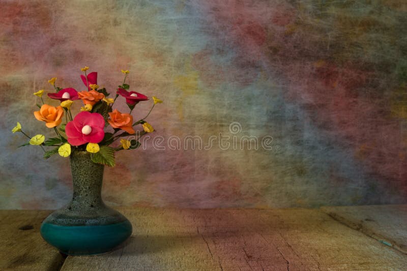 Vase flower with wooden platform,light vintage tone filter proce royalty free stock image