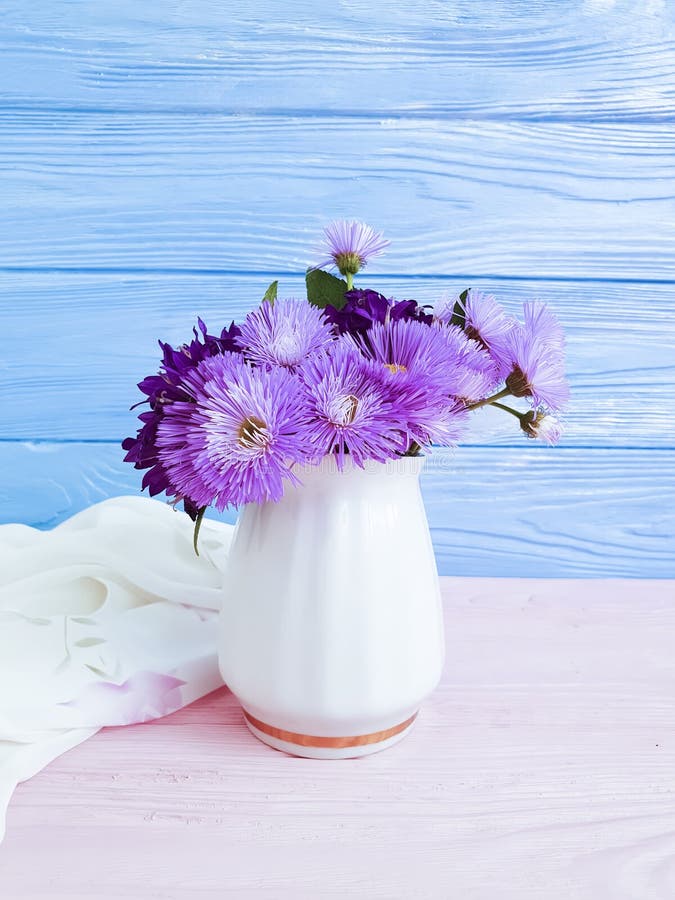Vase flowers bell, purple elegance romance spring chrysanthemum arrangement on a wooden background