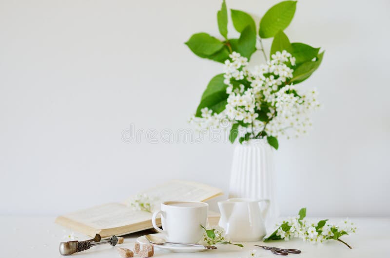 Vase with White Flowers Bird Cherry Tree, Morning, Cup with Coffee, Old Book