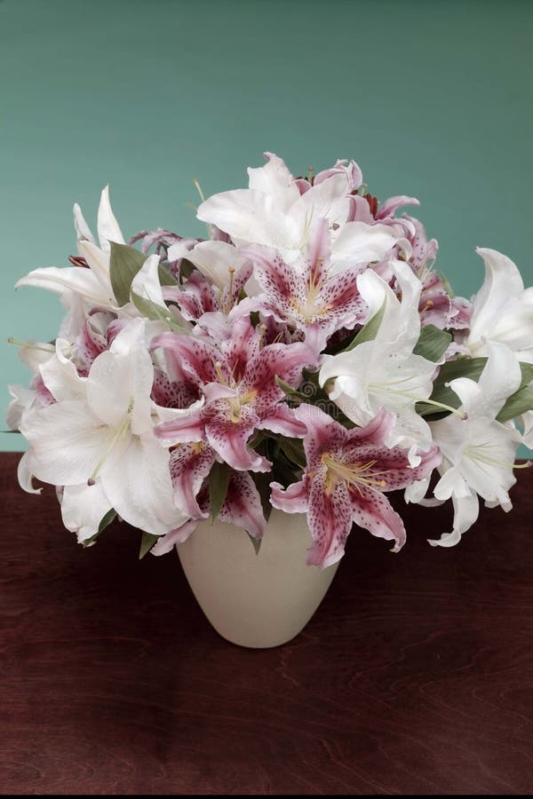 Vase of white and pink flowers