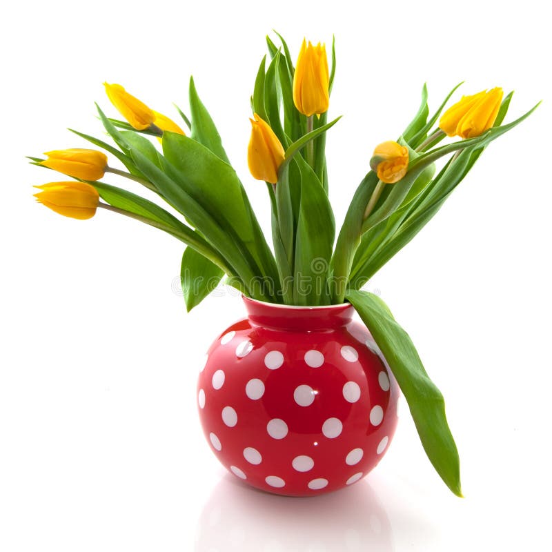 Vase with yellow tulips