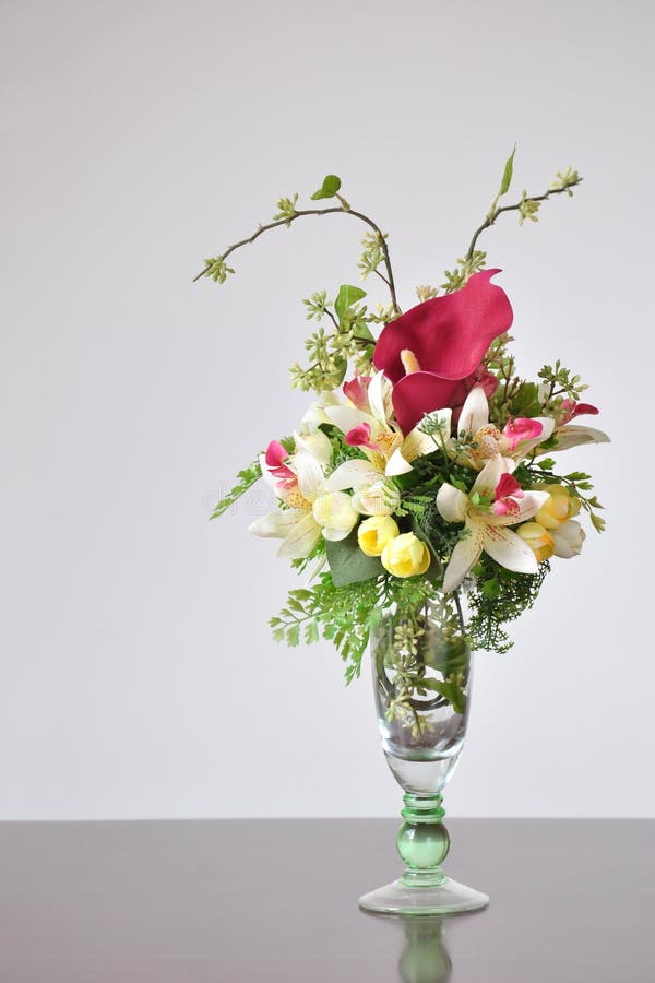 Vases Artificial Flowers on the Desk. Stock Image Image of glass