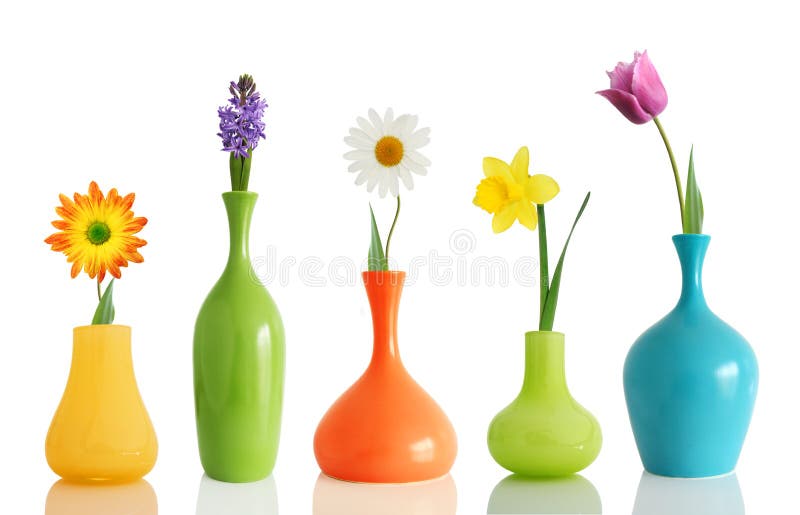 Colorful spring flowers in bright vases on white. Colorful spring flowers in bright vases on white
