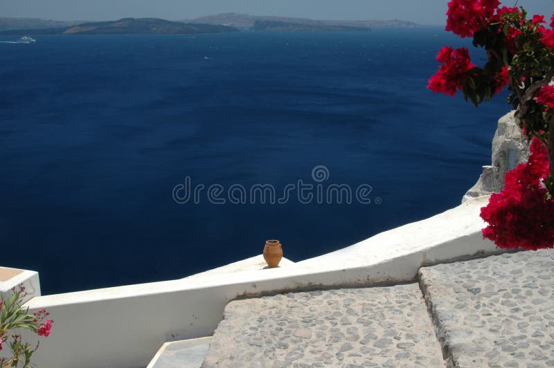 Ceramic vase over the sea santorini greek islands cruise ship in distance. Ceramic vase over the sea santorini greek islands cruise ship in distance