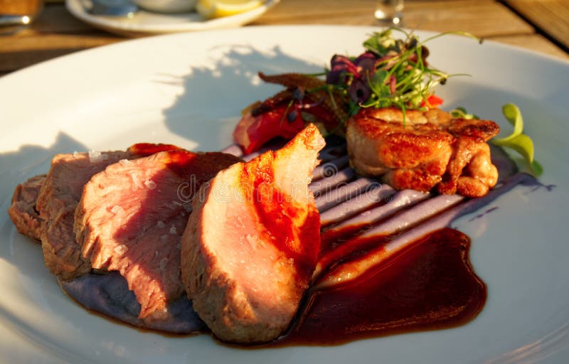 Veal fillet with violet potato mash, sweetbread and vegetables