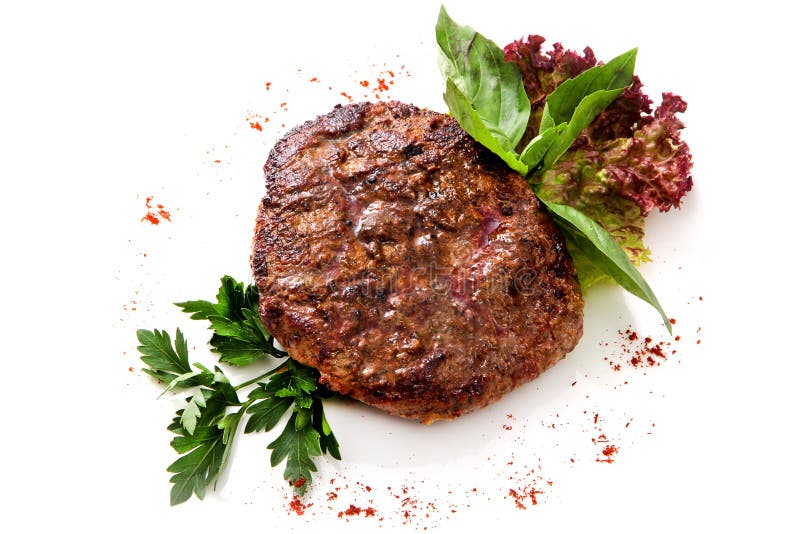 Veal steak with greens and herbs stock image Veal steak with greens and herbs stock image