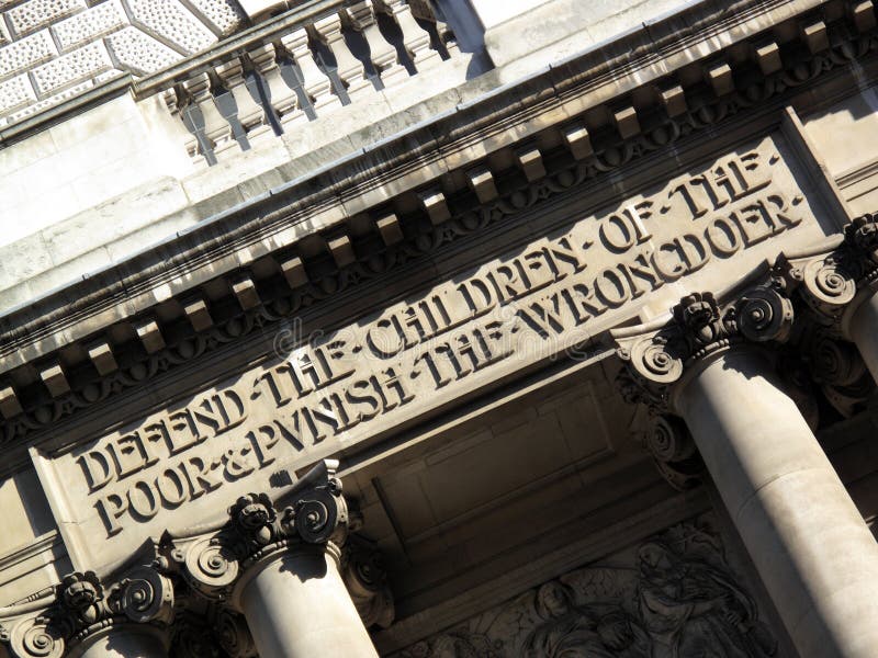 Inscription above the entrance of the Central Criminal Court fondly known as The Old Bailey, which reads 'Defend the children of the poor and punish the wrongdoer'. Inscription above the entrance of the Central Criminal Court fondly known as The Old Bailey, which reads 'Defend the children of the poor and punish the wrongdoer'