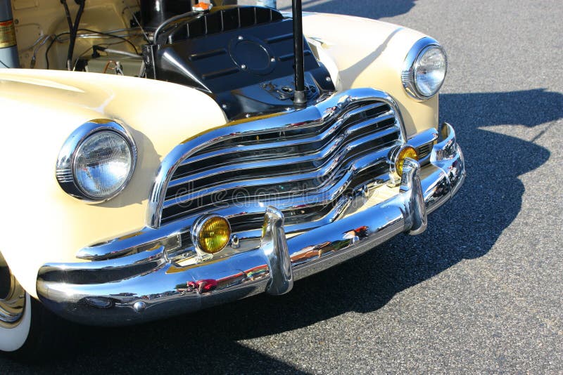 Details of an old car's front in a car show. Details of an old car's front in a car show.