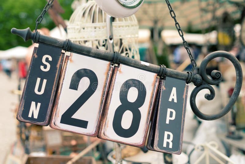 Old perpetual iron calendar at the flea market. Old perpetual iron calendar at the flea market