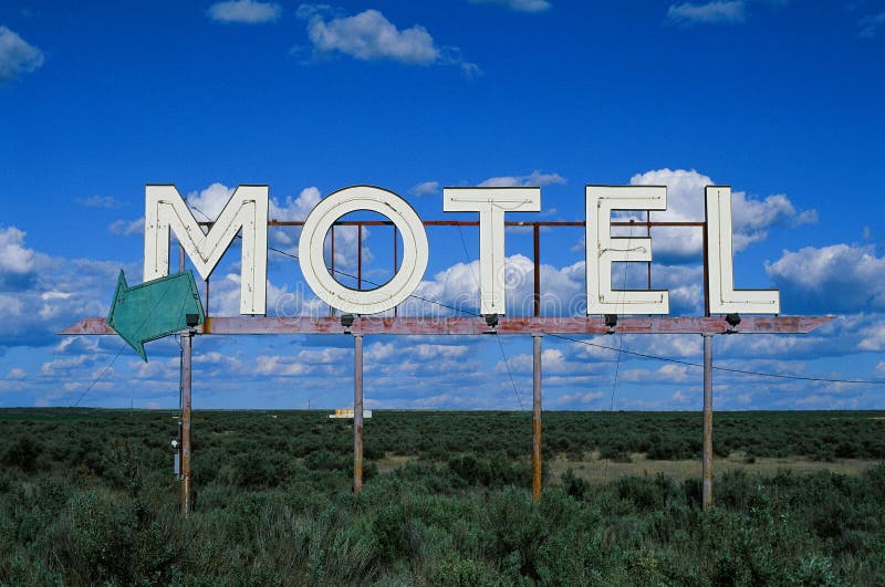 An old abandoned motel sign left on the side of a highway. I took this photo with 35mm Fujifilm Velvia 50 film stock with my Nikon F4. An old abandoned motel sign left on the side of a highway. I took this photo with 35mm Fujifilm Velvia 50 film stock with my Nikon F4.