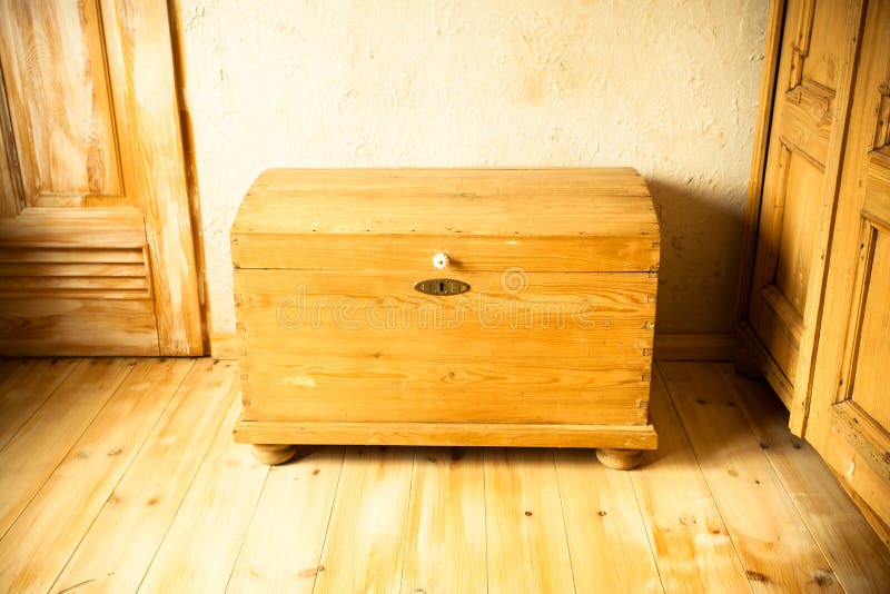Retro style. Old wooden chest like treasure box in the attic. Interior. Retro style. Old wooden chest like treasure box in the attic. Interior.