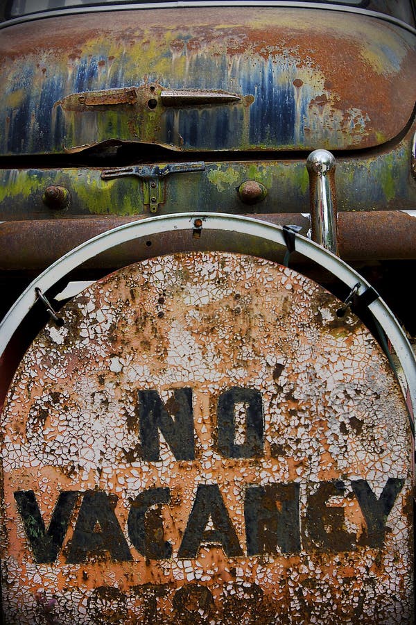 Motel no vacancy sign and rusted vintage car on Route 66 in the United States. Motel no vacancy sign and rusted vintage car on Route 66 in the United States